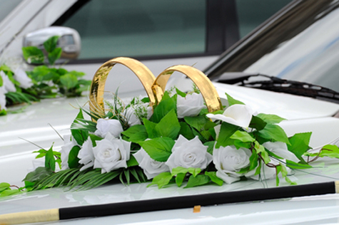 Beautiful floral decoration is on a wedding car